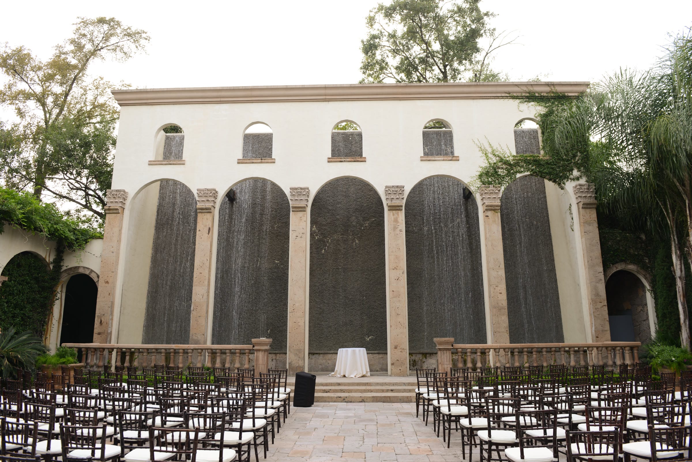 The cascading Water Wall in the courtyard at The Bell Tower on 34th in Houston, in daylight